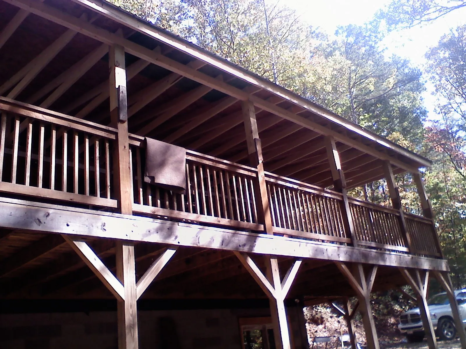 Timber framing under a new elevated porch and deck — Roof Leak Repair in Buffalo Creek by Roofing Brothers